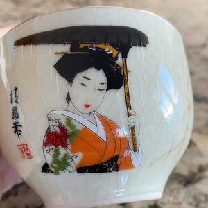 Elegant Japanese Tea Cup with Geisha Design